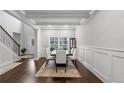 Formal dining room with hardwood floors and wainscoting at 3759 Chapel Cove, Douglasville, GA 30135