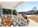 Relaxing front porch with rocking chairs and view of the street at 138 Bent Creek Dr, Dallas, GA 30157