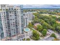 High-rise building with pool and surrounding green space at 222 12Th Ne St # 1701, Atlanta, GA 30309