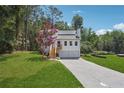 Newly renovated house with a two-car garage and landscaped lawn at 2909 Emerald Ln, Acworth, GA 30102