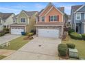 Two-story townhome with stone accents and a two-car garage at 7167 Rigel Sw Bnd, Atlanta, GA 30331