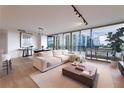 Spacious living area featuring hardwood floors and stunning city views at 700 Park Regency Ne Pl # 1306, Atlanta, GA 30326