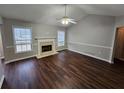 Spacious living room featuring a fireplace and hardwood floors at 6969 Pine Shadow Way, Winston, GA 30187