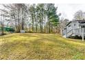 Large backyard with a shed and plenty of green space at 6685 Buckhurst Trl, Atlanta, GA 30349