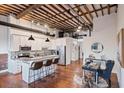 Modern kitchen with white cabinets, breakfast bar, and stainless steel appliances at 150 Walker Sw St # 5, Atlanta, GA 30313