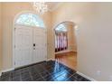 Bright entryway with tile floors, hardwood floors, and a chandelier at 5170 Stone Croft Trl, Atlanta, GA 30331