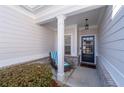 Inviting front porch with seating and brick accents at 2325 Button Head Nw Run, Kennesaw, GA 30144