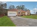 House exterior with a driveway and a neatly kept lawn at 141 Hunters Way, Villa Rica, GA 30180