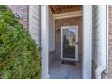 Inviting front entrance with stone accents and a storm door at 3112 Spicy Cedar Ln, Lithonia, GA 30038