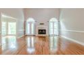 Spacious living room with hardwood floors and fireplace at 3420 Forest Valley Way, Cumming, GA 30041