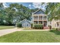 Two-story house, blue siding, white columns, and a landscaped yard at 2791 Glenvalley Dr, Decatur, GA 30032