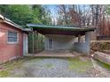 Detached carport with block walls and gravel flooring at 3953 Rhyne Se Way, Smyrna, GA 30082