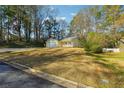 Ranch style home nestled in a wooded area at 5862 Homestead Cir, Rex, GA 30273