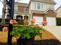 Landscaped front yard with flower pot and home view at 3144 Delacorte Dr, Acworth, GA 30101