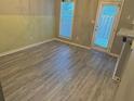 Dining area with vinyl plank flooring and access to backyard at 230 Valley Xing, Canton, GA 30114