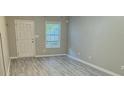 Bright living room featuring gray walls and vinyl plank flooring at 230 Valley Xing, Canton, GA 30114