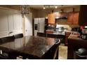Granite top kitchen island anchors this eat-in kitchen at 5626 Laurel Ridge Dr, Atlanta, GA 30344