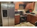 Stainless steel appliances and wood cabinets in this kitchen at 5626 Laurel Ridge Dr, Atlanta, GA 30344