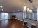 Open living area with hardwood floors, fireplace and breakfast bar at 970 Sidney Marcus Ne Blvd # 1316, Atlanta, GA 30324