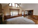 Bright living room with hardwood floors, vaulted ceilings, and a stone fireplace at 1040 Henry Ter, Lawrenceville, GA 30046