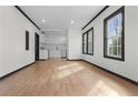 Open concept living room and kitchen with hardwood floors at 391 S Bend Se Ave, Atlanta, GA 30315