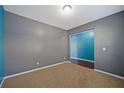 Empty home office with gray and blue walls at 3680 Shale Ln, Conyers, GA 30013