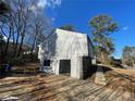 Updated home's side exterior with stone accents and a sliding door at 3417 Hollow Tree Dr, Decatur, GA 30034