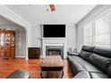 Living room with hardwood floors, fireplace, and sectional sofa at 87 Amber Ln, Dallas, GA 30157