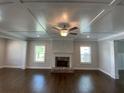 Spacious living room featuring hardwood floors, a fireplace, and a coffered ceiling at 1999 Gladys Ct, Marietta, GA 30064