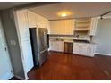 Eat-in kitchen with stainless steel appliances and white cabinets at 2965 Pharr Court South Nw # 815, Atlanta, GA 30305
