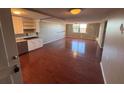 Spacious living room with hardwood floors and a kitchen at 2965 Pharr Court South Nw # 815, Atlanta, GA 30305