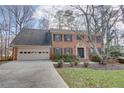 Two-story brick home with a large front yard at 3736 Bloxham Ct, Atlanta, GA 30341