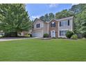 House with stone accents, attached garage, and large yard at 449 Two Iron Nw Trl, Kennesaw, GA 30144