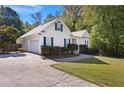 Exterior of the house, showing a driveway and garage at 5555 Christi Dr, Douglasville, GA 30135