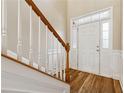 Front entry with hardwood floors and elegant staircase at 2368 Harshaw Ave # 166, Lawrenceville, GA 30043