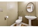 Small powder room with pedestal sink and toilet at 2368 Harshaw Ave # 166, Lawrenceville, GA 30043