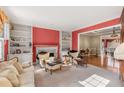 Spacious living room with fireplace, built-in shelving, and hardwood floors at 1138 Haven Glen Ne Ln, Brookhaven, GA 30319