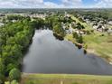 Aerial view of a lake and surrounding houses at 521 Bay Stand Ln, Loganville, GA 30052