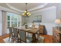 Formal dining room with hardwood floors and a chandelier at 502 Spirlet Ct, Woodstock, GA 30188