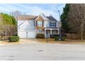 Two-story house with stone accents and a two car garage at 502 Spirlet Ct, Woodstock, GA 30188