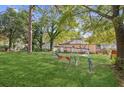 Large backyard with a swing set and mature trees at 633 Tom Read Dr, Marietta, GA 30062