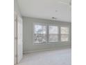 Bright bedroom with three windows and neutral wall paint at 1762 Caswell Pkwy # 33, Marietta, GA 30060