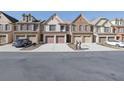Row of townhouses featuring two-car garages and attractive street appeal at 1762 Caswell Pkwy # 33, Marietta, GA 30060