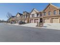 Curved street showcasing multiple townhouses with attached garages at 1762 Caswell Pkwy # 33, Marietta, GA 30060