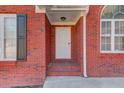 White front door with sidelights at 100 Jessamine Trl, Lawrenceville, GA 30046