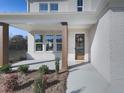 Front porch entry with wooden columns and decorative wreath at 2144 Suncrest Pt, Marietta, GA 30064