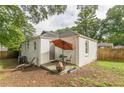 Relaxing backyard patio with seating, fire pit, and partial privacy fence at 723 Campbell Cir, Hapeville, GA 30354