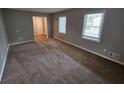 Large living room with neutral walls and carpeting at 2314 Emerald Springs Dr, Decatur, GA 30035