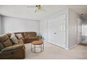 Living room with brown sectional sofa and coffee table at 5644 Strathmoor Manor Cir, Lithonia, GA 30058