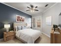 Spacious bedroom with a plush bed and accent wall at 3621 Vinings Slope Se # 1331, Atlanta, GA 30339